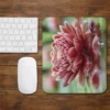 red dahlia flower mouse pad on wooden desk aesthetic gaming desk setup with keyboard and mouse
