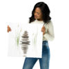 Stacked zen stones reflected in calm water with green grasses, minimalist neutral spa wall art