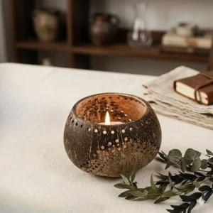 Eco-friendly coconut shell candle holder styled with greenery, boho natural home decor aesthetic with sustainable materials